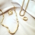 Anel Elos Largos e Baguetes Cristais Banhado a Ouro - comprar online