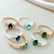Anel Pedra Verde Oval e Zircônias Cristais Banhado a Prata - comprar online