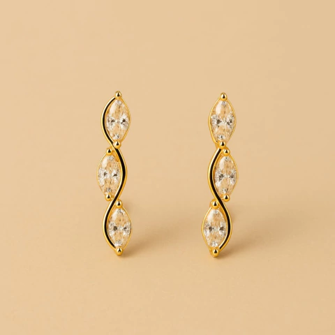 Brinco Ear Cuff Três Zircônias Elipses Banhado a Ouro - comprar online
