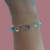 Pulseira Zircônias Penduradas Tons Claros Banhada a Ouro - comprar online