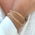 Pulseira Escamas e Mini Corações Banhada a Ouro - comprar online