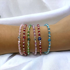 VOL-100-2 Pulseras Cristal de Roca con Ojito - Variedad de Colores Acero Blanco - comprar online