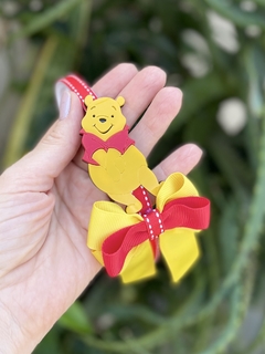 Coleção laço e tiara Pooh na internet