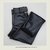 Calça térmica reta de courino preto, com elástico no cós e detalhes em botões forrados.