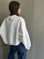 Buzo Cosmos off white en internet