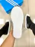 Adidas Slip On Preto/Branco na internet