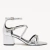 Sandália feminina prata em couro, com bico folha e fivela, salto bloco médio e tiras finas, modelo Sophie da marca Loulle. 