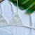 TOP TRIANGLE OFF WHITE na internet