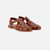 Sandalias Romas de cuero marrón con suela plana y diseño entrelazado.