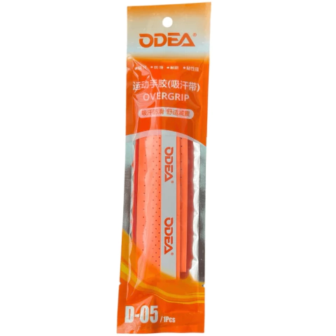 Cubre Grip Odea perforado con relieve en color naranja flúor en su empaque.