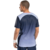 Hombre vistiendo una remera Nox Pro Fit azul marino vista desde atrás.
