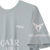Remera Nox Sponsors AT10 Gris con logos de patrocinadores en el pecho y manga