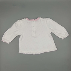 Remera Lu Talle 3 meses blanca con lunares rosas y florcitas bordadas - comprar online