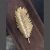 ADORNO PLUMA metal aluminio - Rancho Deco