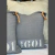 Almohadon Nido 40x40 con tirador de cuero - tienda online