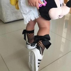 Meia arrastão preta com laço preto - comprar online