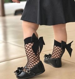 Meia arrastão preta com laço preto