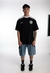 REMERA OVER CONCRETE STUDIO NEGRO M/BLANCA SIGNOS