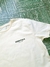 Remera Essentials Beige Espalda en internet