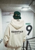 Buzo Hoodie Essentials beige cream Over premium espalda