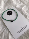 Pulsera ELASTIZADA MOSTACILLAS OJITO VERDE