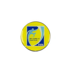 Moneda amarilla para sorteo con logo FIFA y texto "My Game is Fair Play"