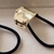 Amarrador Bone (dourado/prateado) - comprar online